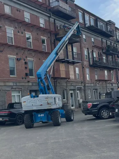 Boom lift at a brick building in Boston